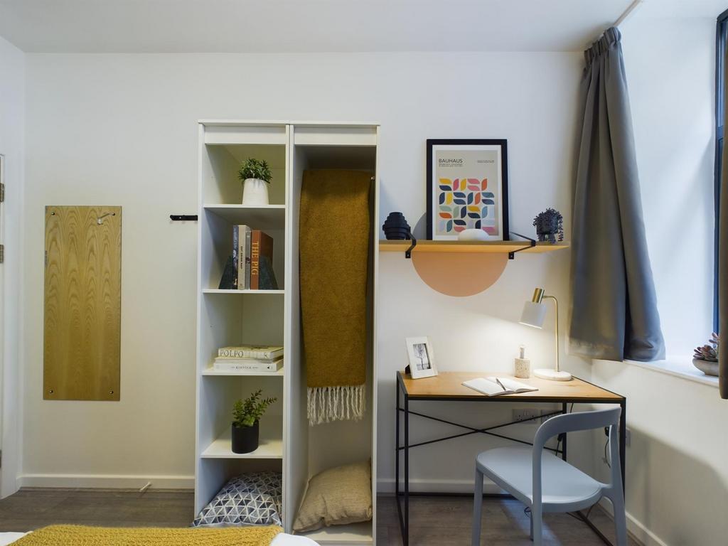 A stylish and inviting double bedroom with ampl...