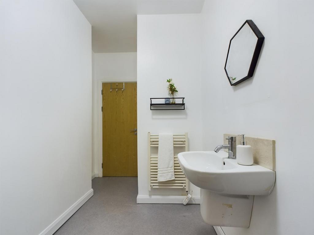 A clean and tidy bathroom featuring modern fixt...