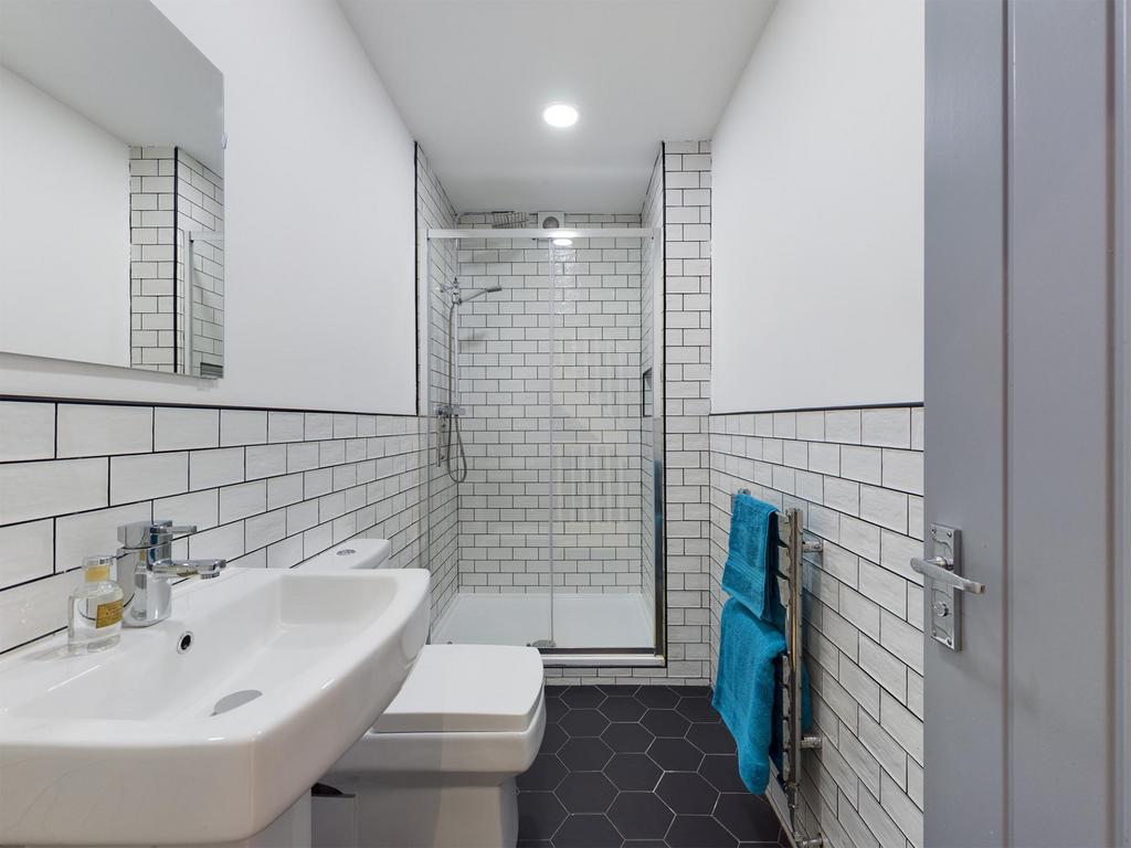Bright and modern bathroom featuring a spacious...