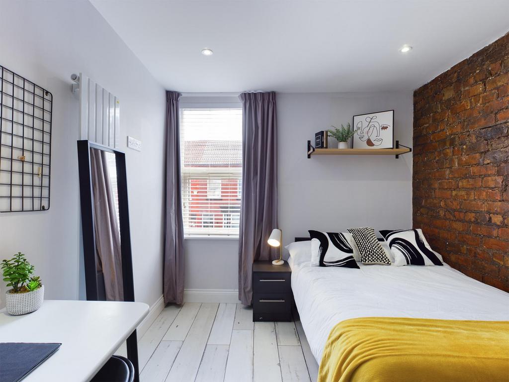 Bright and inviting double bedroom featuring a ...