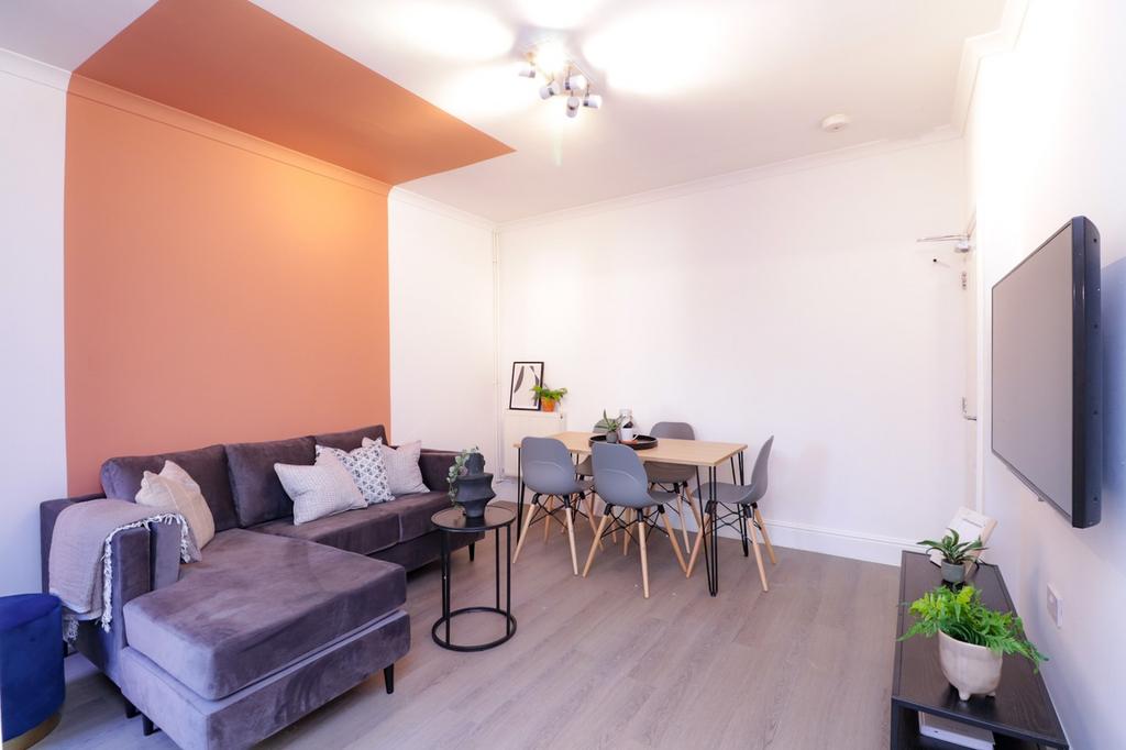A bright and inviting large modern living room ...