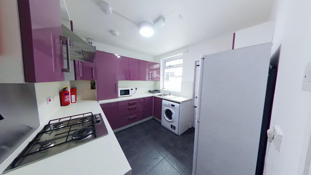 A modern and well-equipped kitchen featuring vi...