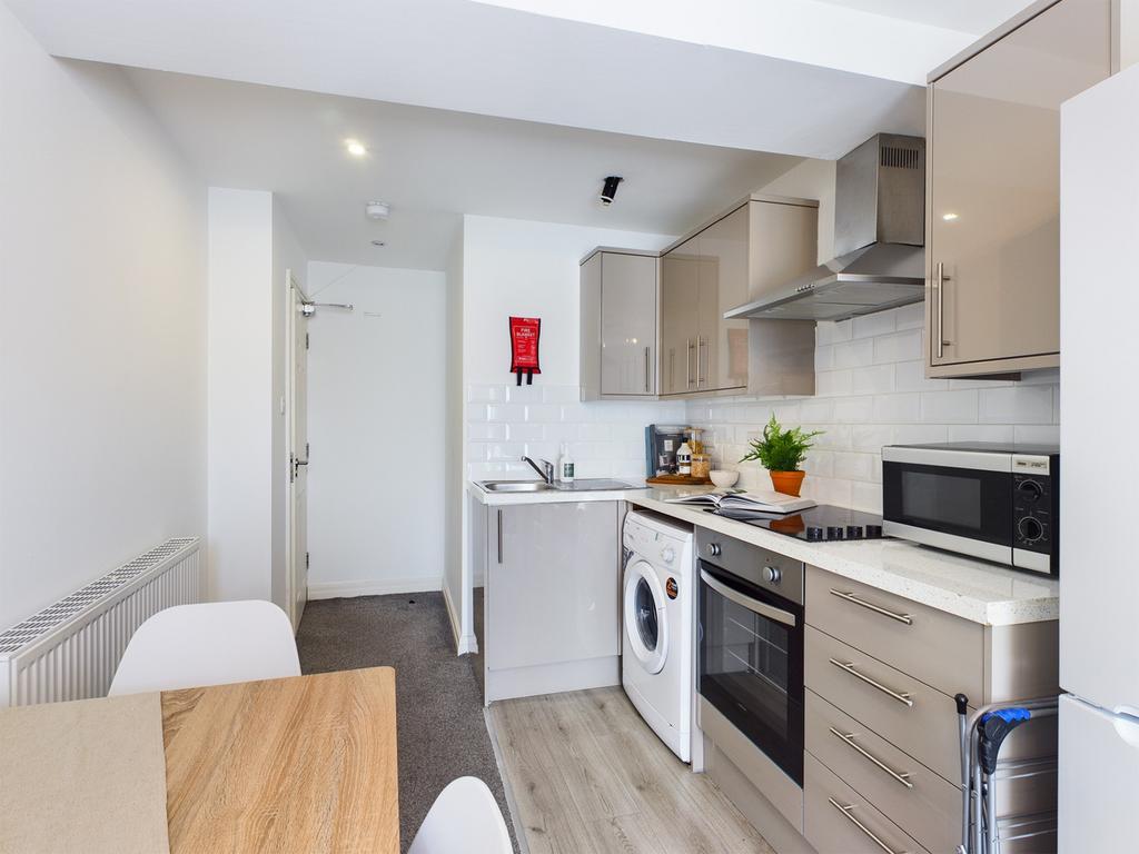 A modern and stylish kitchenette featuring ampl...