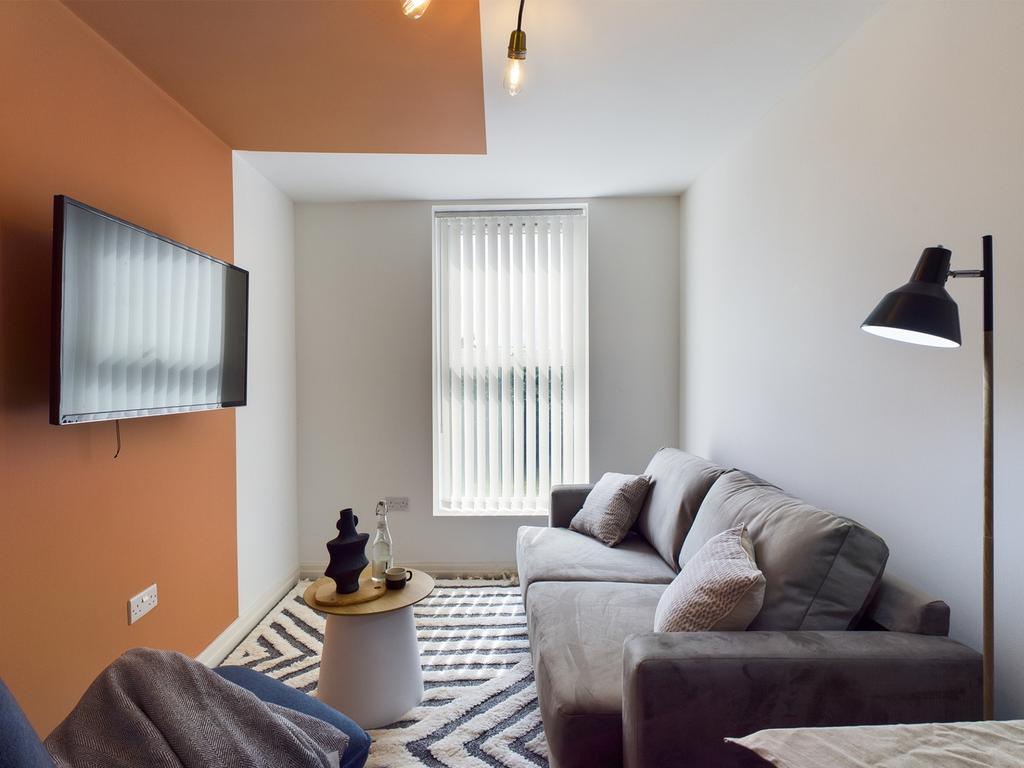 A stylish and inviting living room featuring mo...