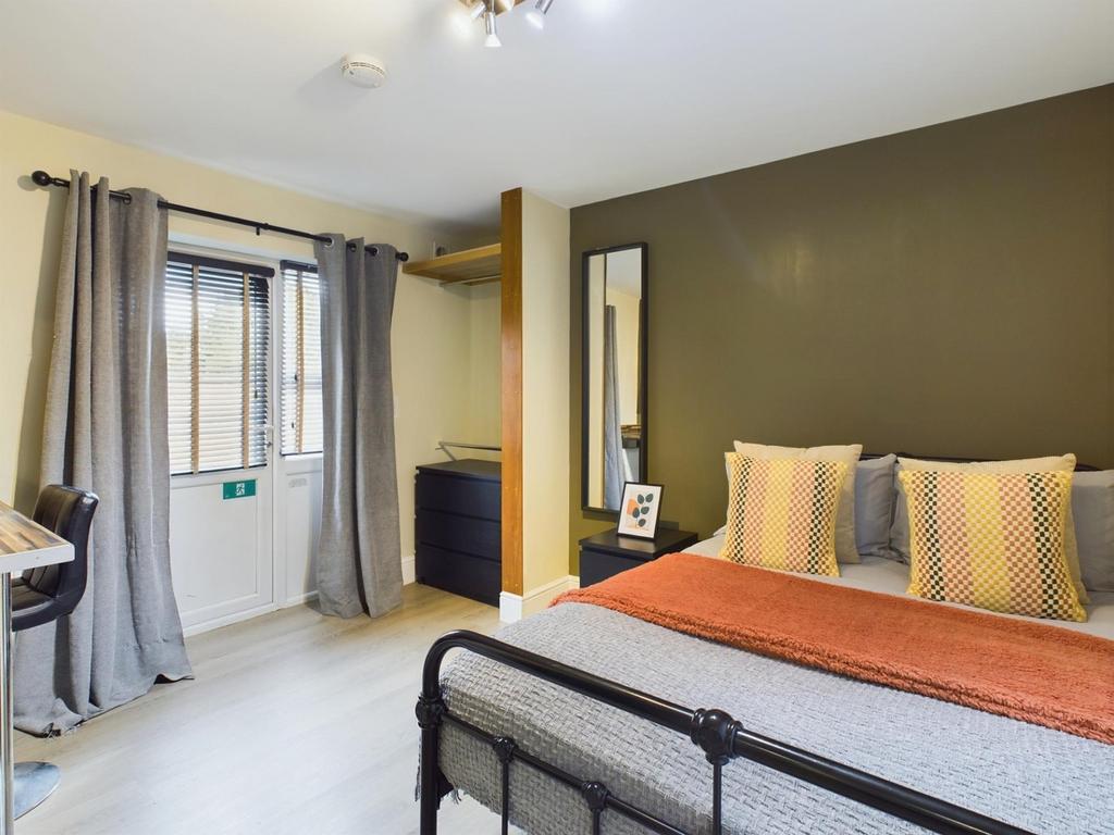 A stylish and inviting double bedroom featuring...
