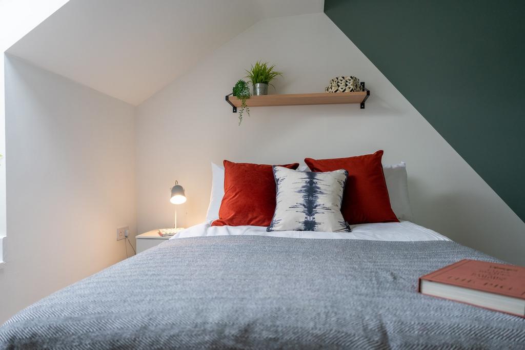 A bright and inviting double bedroom featuring ...