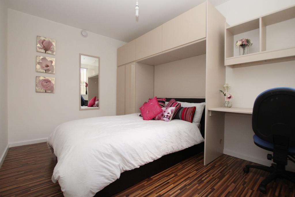 A spacious and well-maintained master bedroom f...