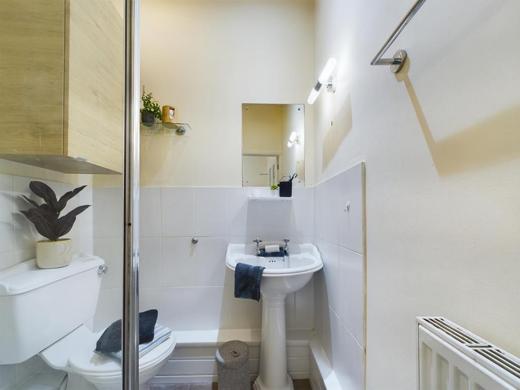 A modern and tidy bathroom with sleek fixtures,...