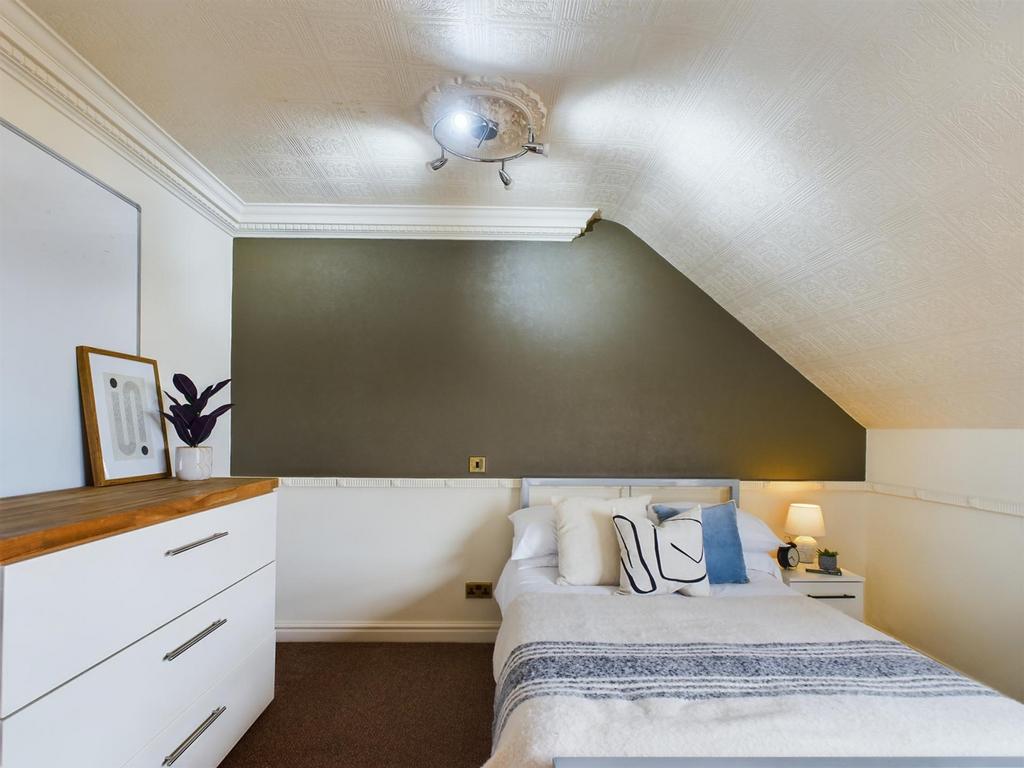 A cozy double bedroom featuring stylish decor a...