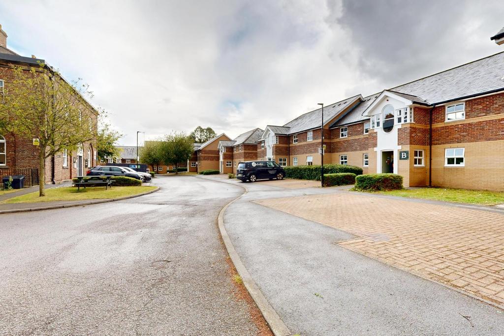Well-maintained residential street with modern ...