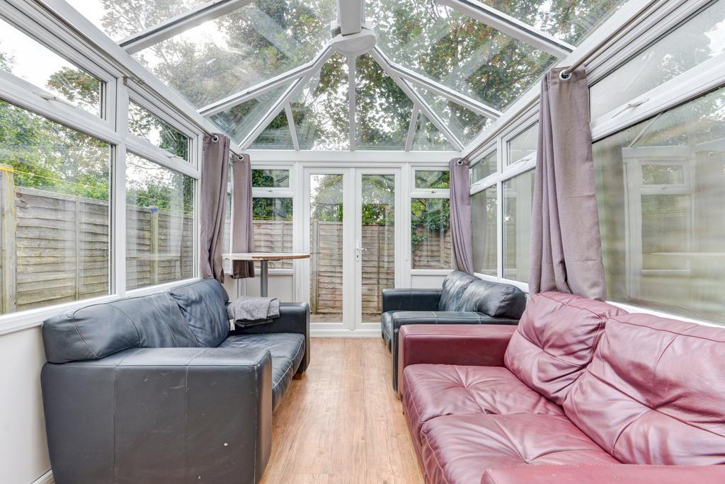 A bright and spacious living area with large wi...