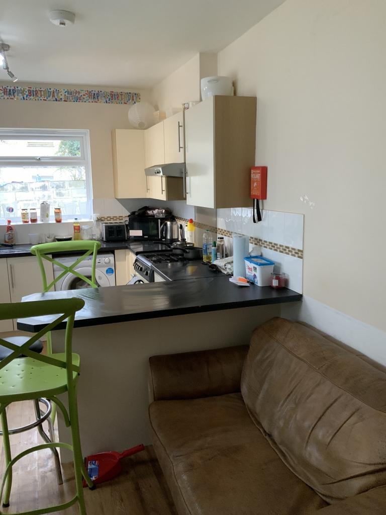Bright and functional kitchen area featuring mo...