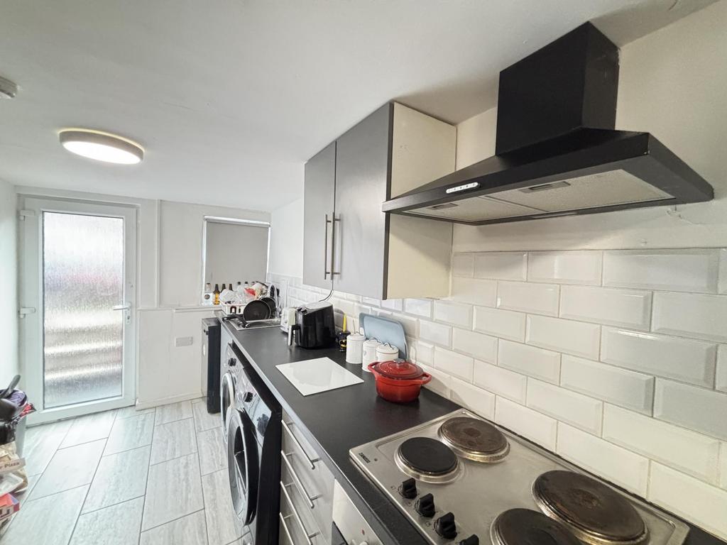 Modern and well-maintained kitchen with ample c...