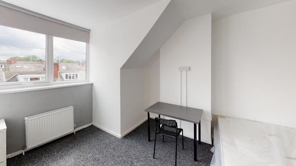 A small, functional bathroom with a minimalisti...