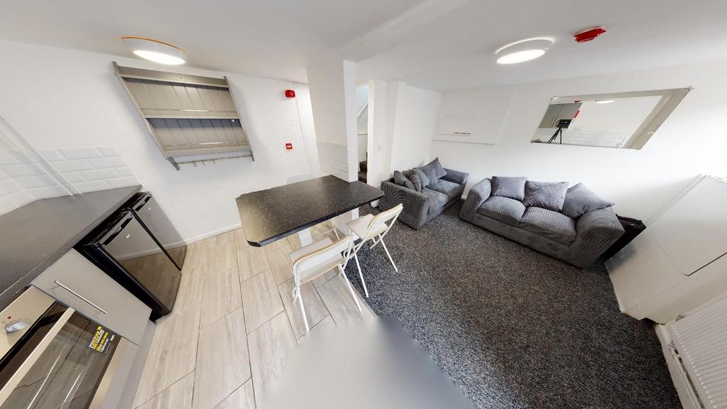 A spacious and modern living room featuring a l...
