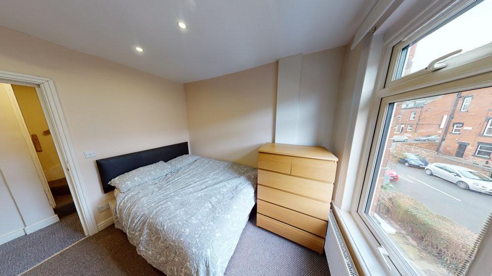Bright and welcoming bedroom featuring a double...