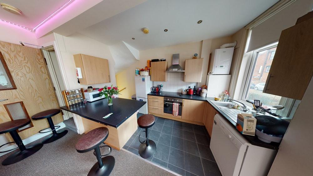 A bright, well-maintained kitchen with ample na...