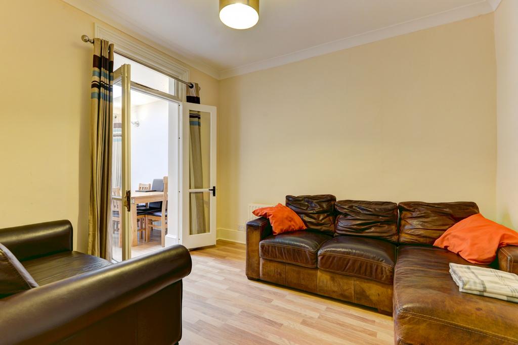 A bright and inviting living room featuring a s...