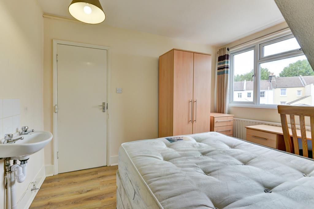 Bright and spacious master bedroom featuring a ...