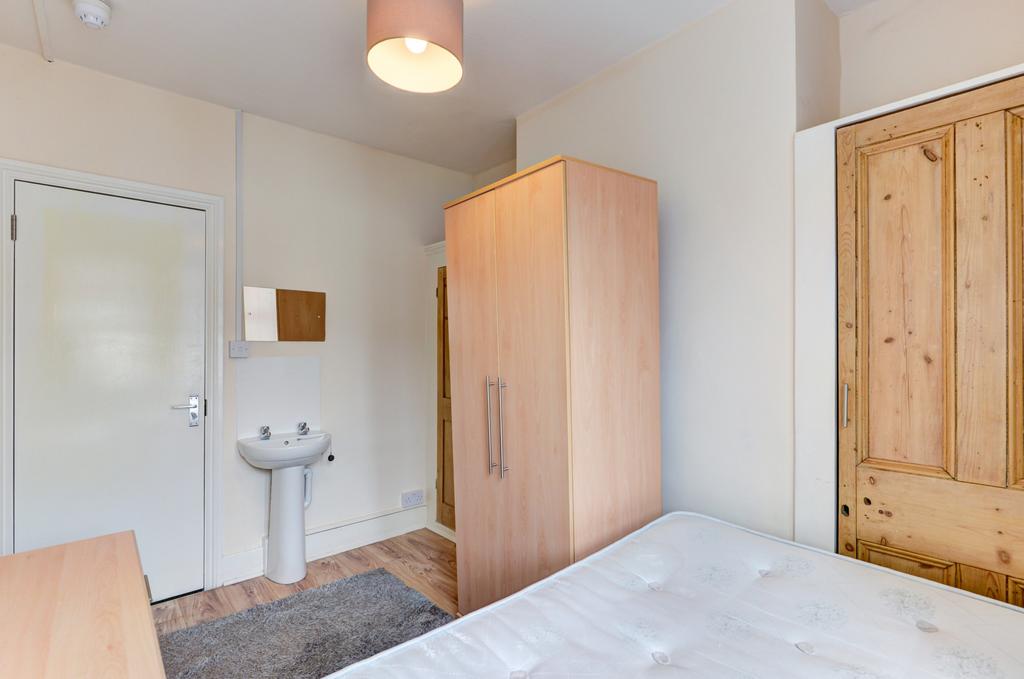 A cozy and well-maintained student bedroom feat...