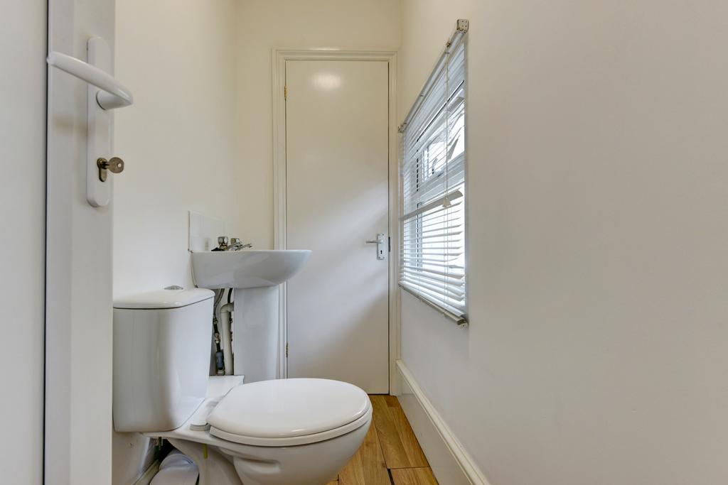 Bright and clean bathroom with a modern toilet ...