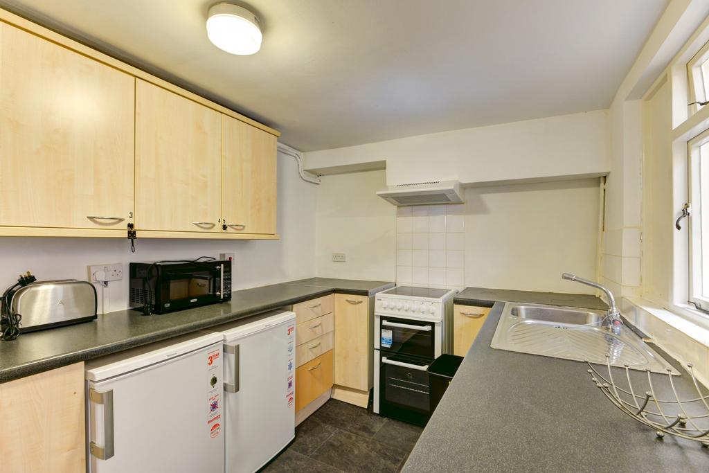 A bright and functional kitchen with ample natu...