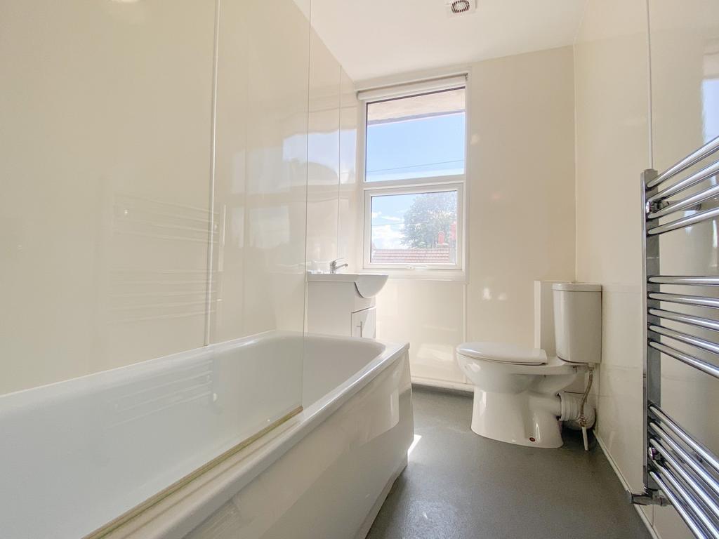 A bright and spacious bathroom featuring a larg...