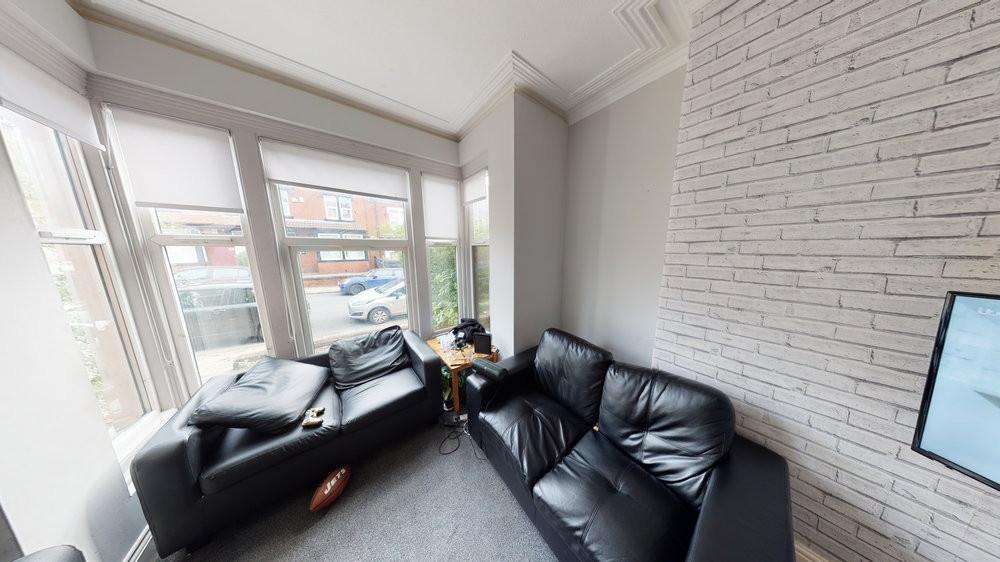 Bright and modern living room with large window...