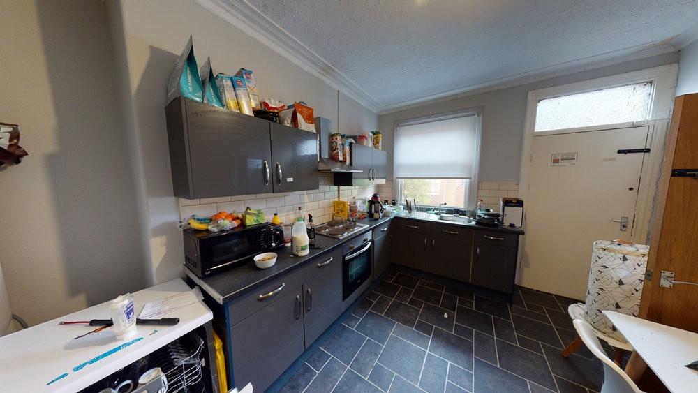 Bright and modern kitchen with ample natural li...