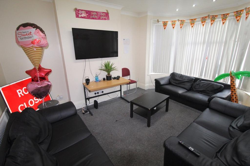 A spacious and inviting living room with modern...