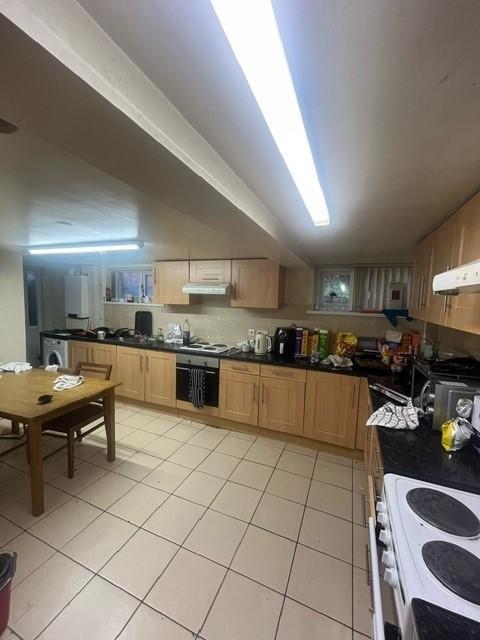 A well-maintained, bright kitchen featuring amp...
