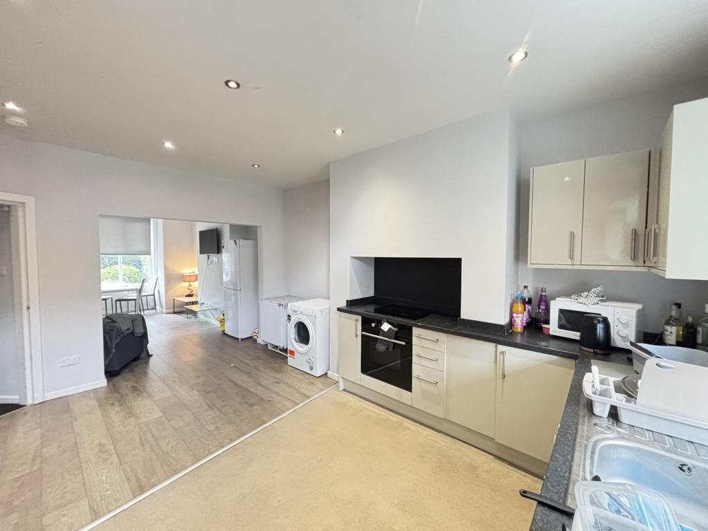 Bright and modern kitchen with ample natural li...