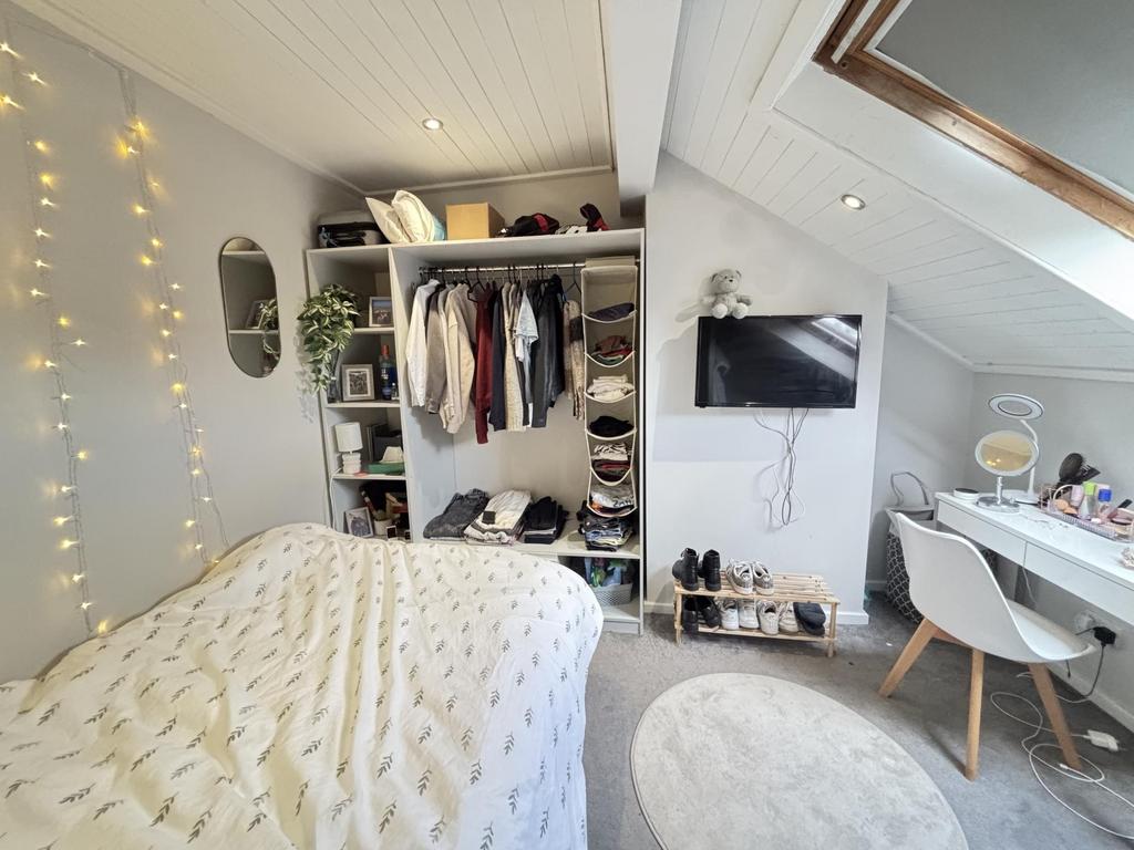 A bright and inviting master bedroom featuring ...