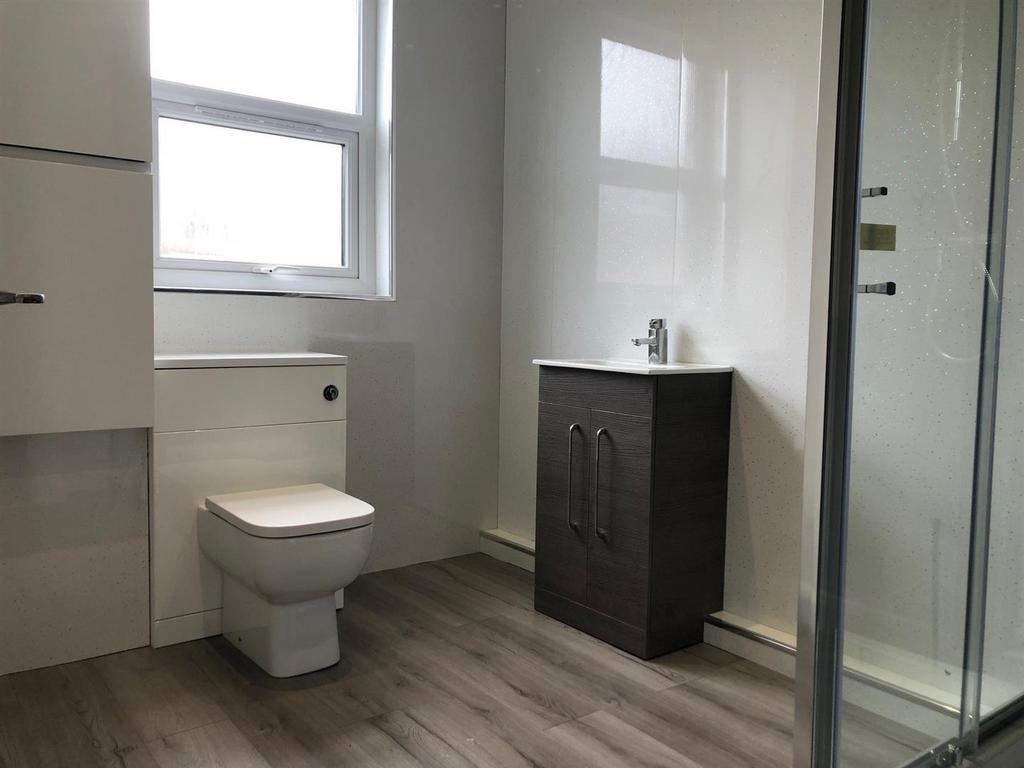 A clean and well-maintained bathroom featuring ...