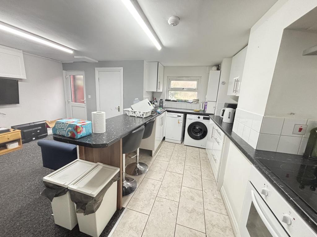 A modern, bright kitchen with ample countertop ...