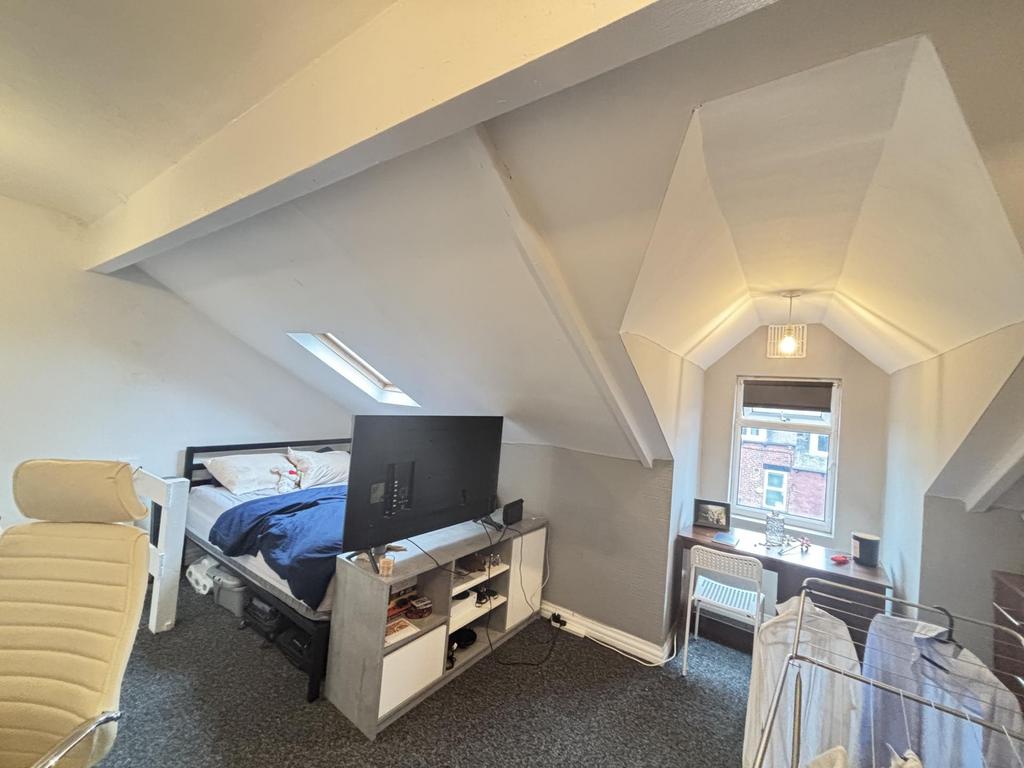 Bright attic double bedroom with sloped ceiling...