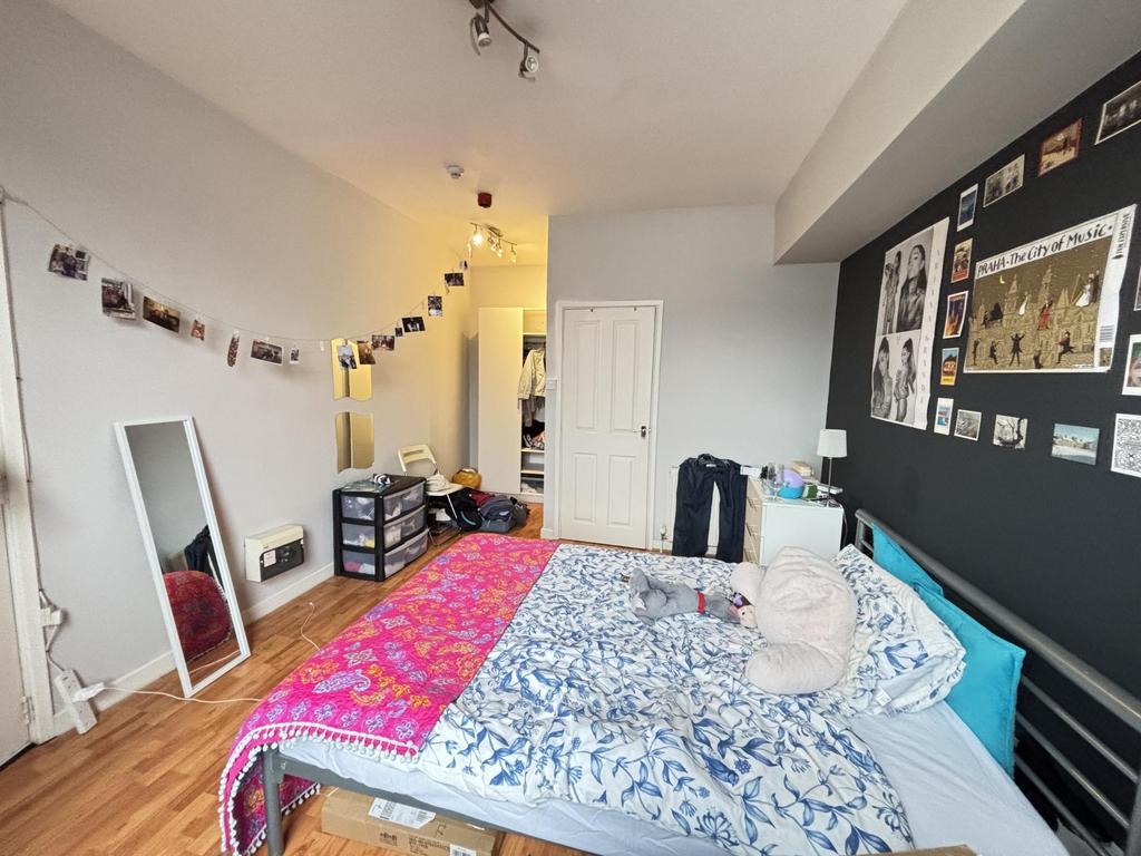 Bright and inviting bedroom featuring a comfort...