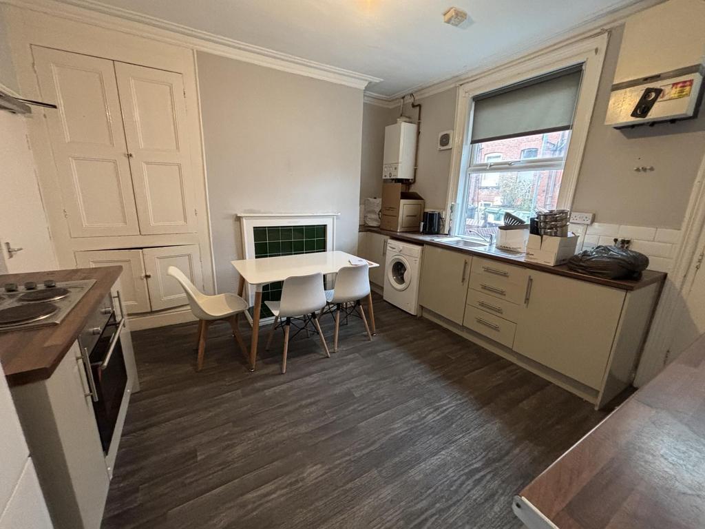 A modern and tidy kitchen area with ample natur...