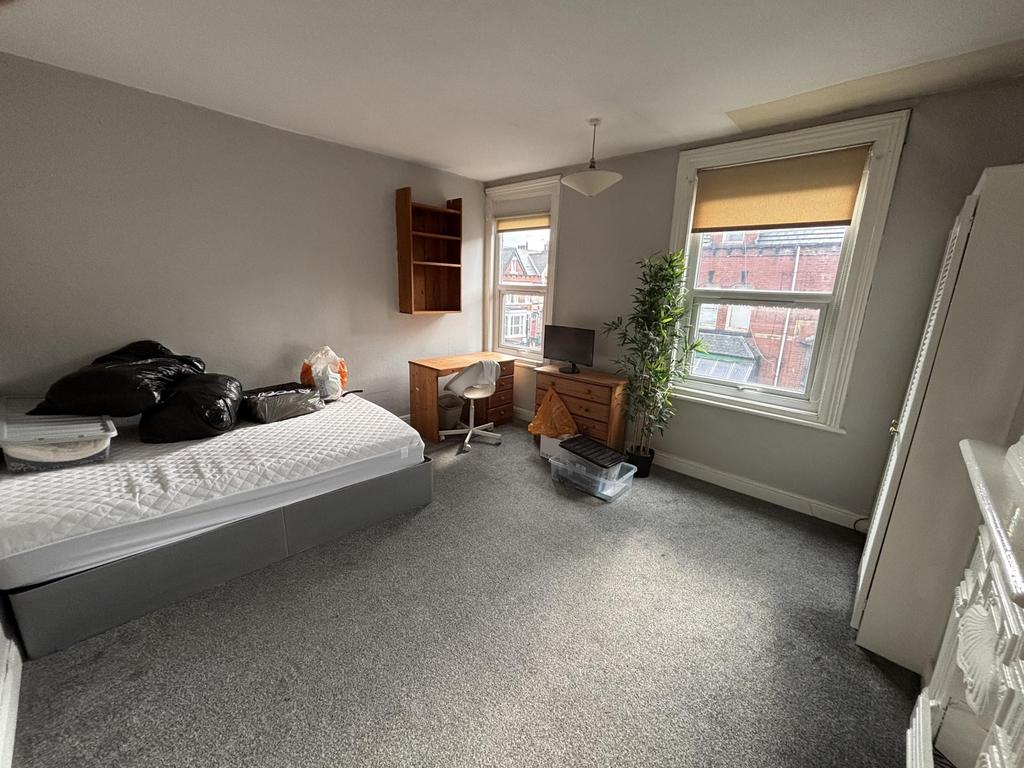 Bright and welcoming living room with large win...