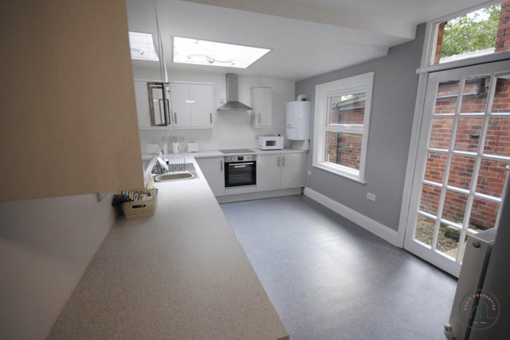 Bright and modern kitchen with ample natural li...