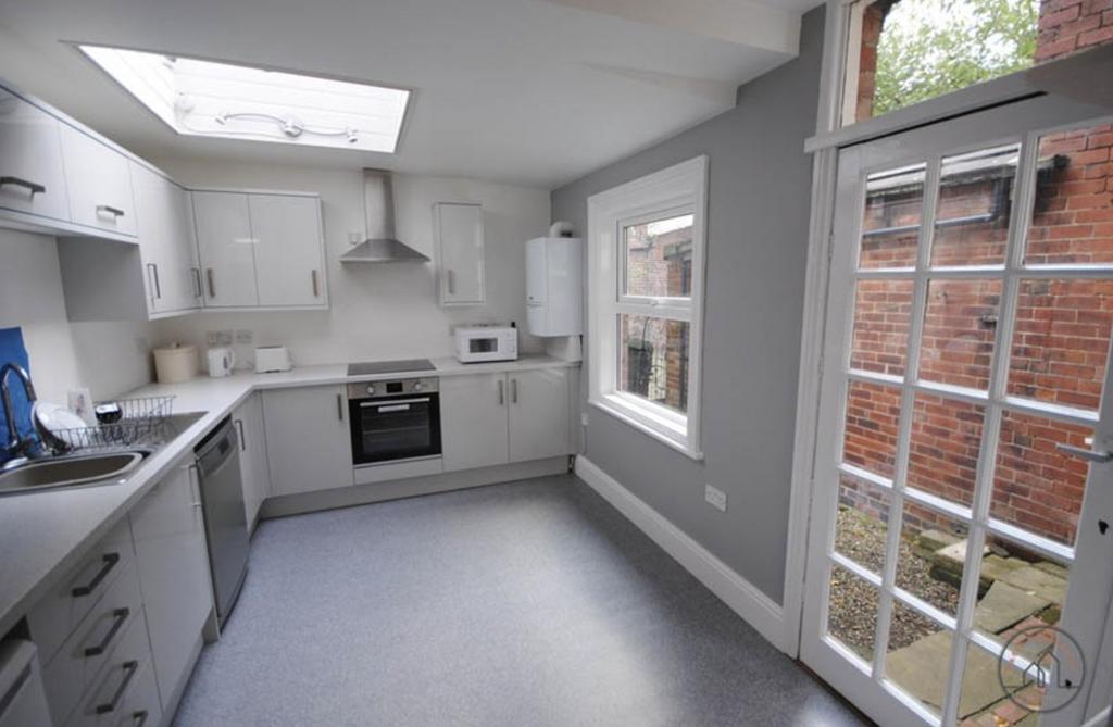Bright and modern kitchen with ample natural li...