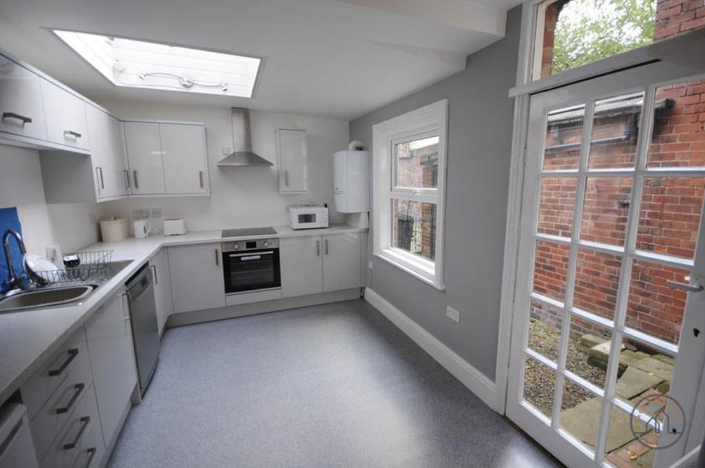 A bright and well-maintained kitchen featuring ...