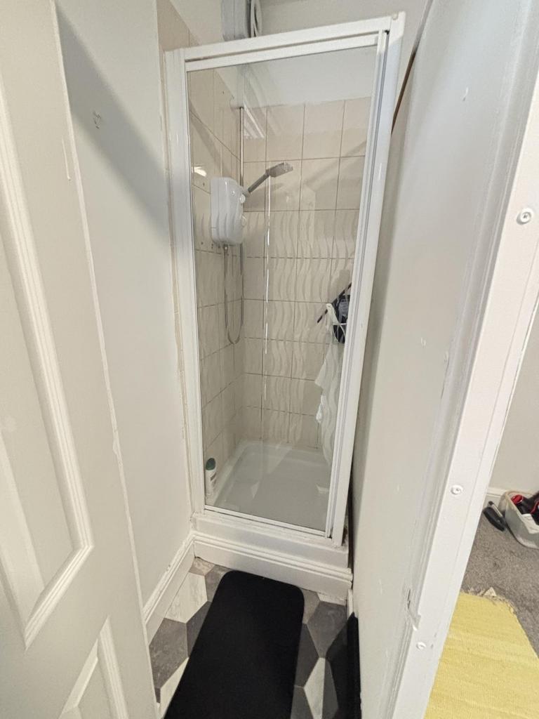 A clean, well-maintained small bathroom with a ...