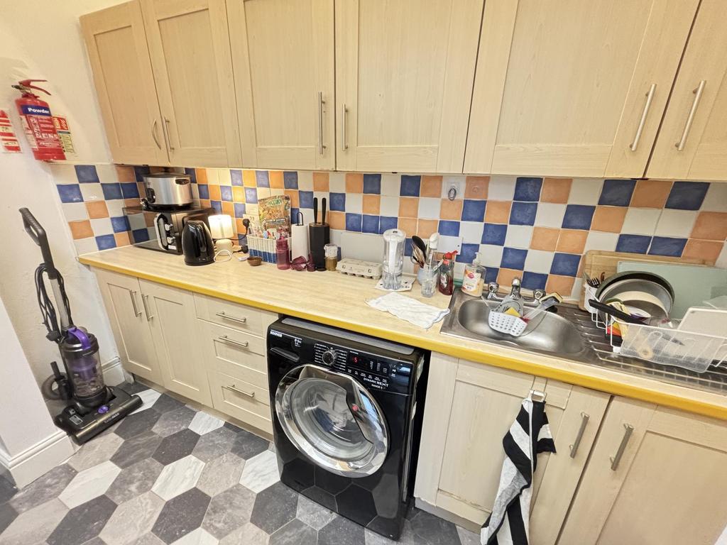 A well-equipped kitchen featuring modern applia...