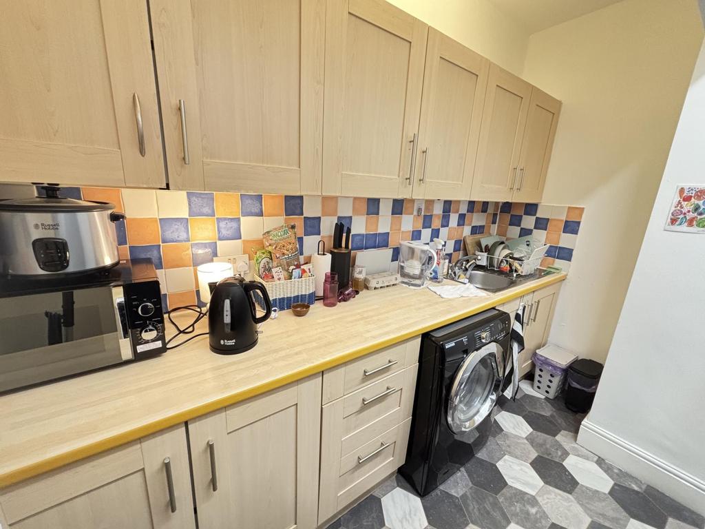 A bright and well-organized kitchen with ample ...