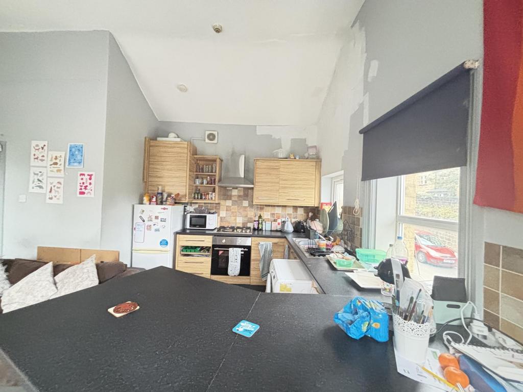 A functional kitchen area with various applianc...