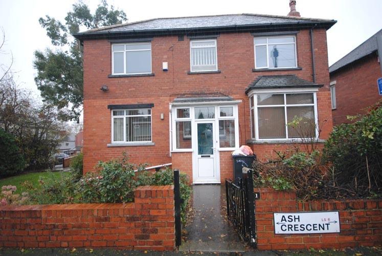 A welcoming front view of a traditional brick r...