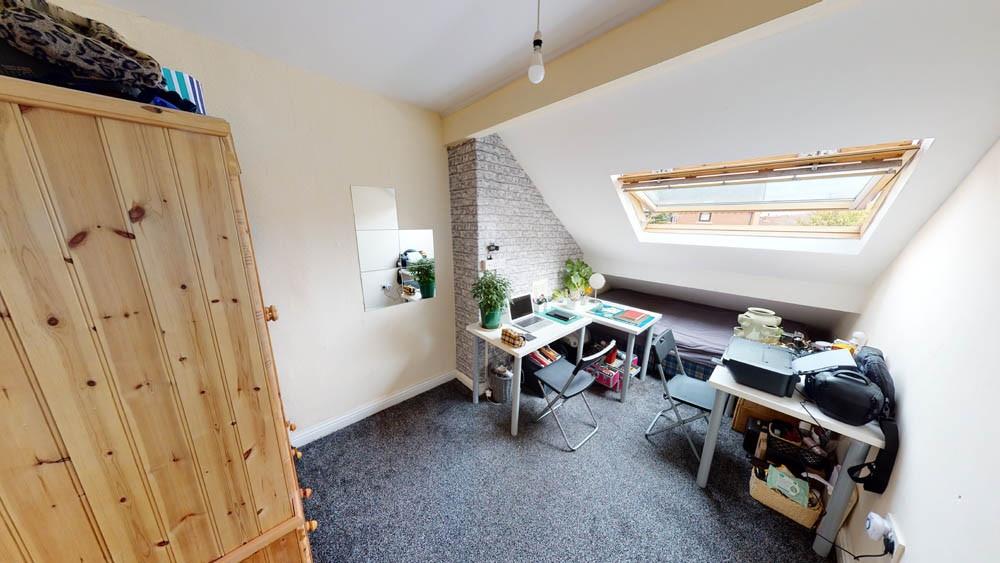 Bright and welcoming bedroom with ample natural...