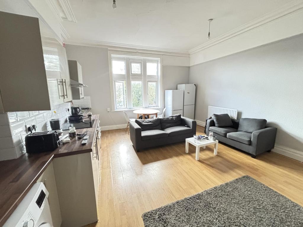 A bright and spacious living room featuring mod...