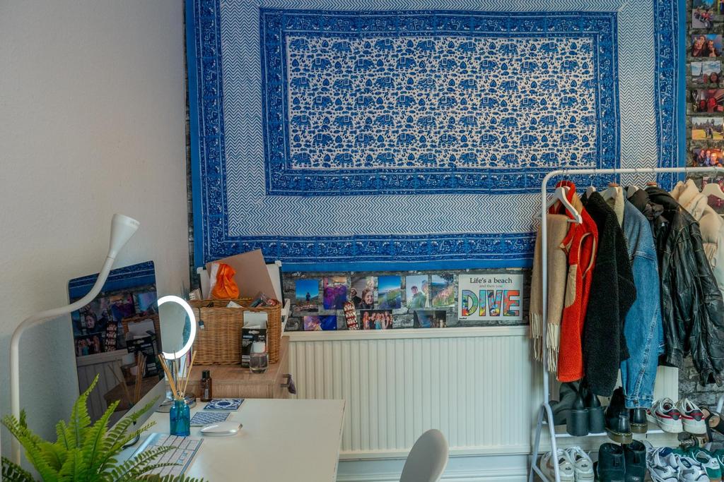 A bright and well-maintained bedroom featuring ...